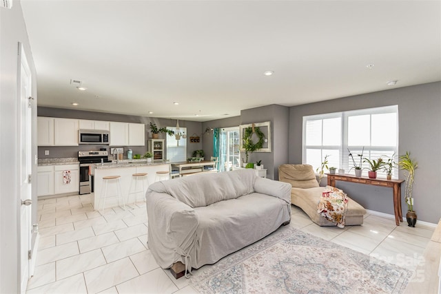 living room featuring light tile patterned floors