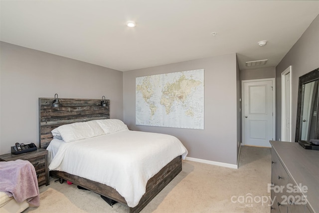 bedroom featuring light carpet