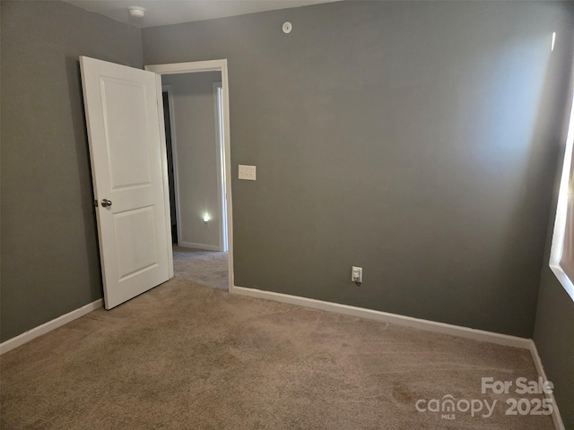 empty room with carpet flooring