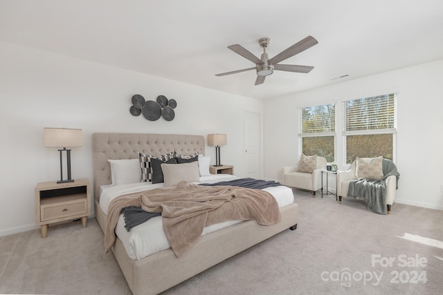 carpeted bedroom with ceiling fan