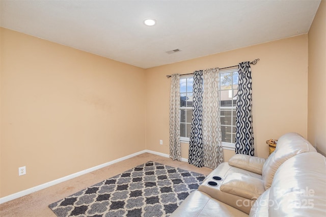 living area featuring carpet flooring