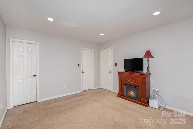 unfurnished living room with light carpet