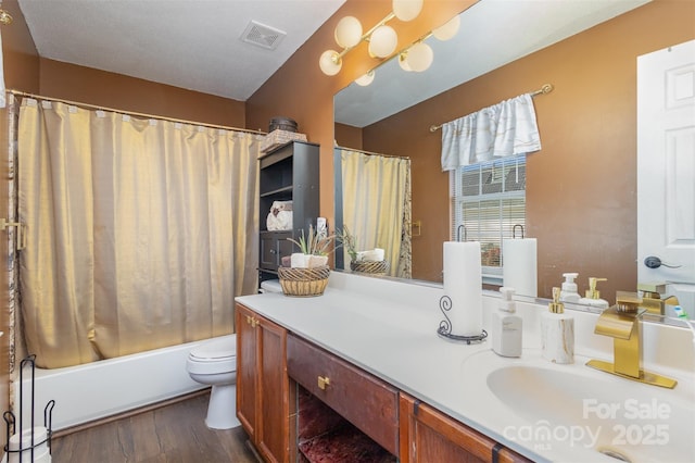 full bathroom with shower / bath combination with curtain, vanity, toilet, and hardwood / wood-style floors