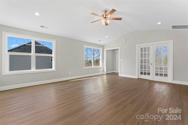 unfurnished living room with french doors, ceiling fan, dark hardwood / wood-style flooring, and vaulted ceiling