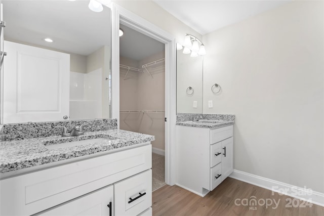 bathroom featuring vanity and hardwood / wood-style flooring