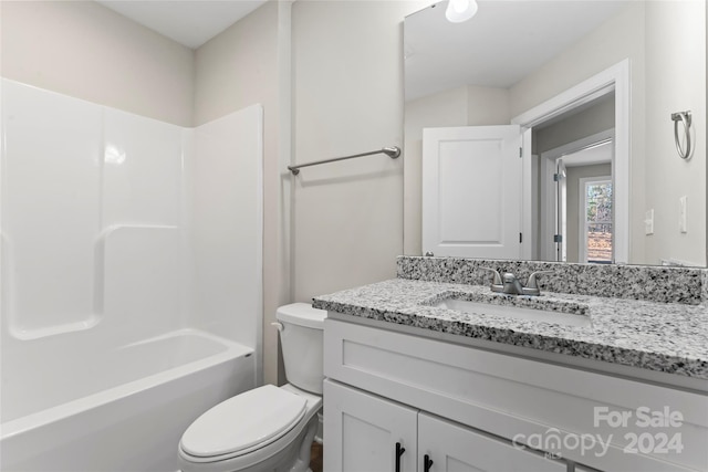 full bathroom with shower / bathing tub combination, vanity, and toilet