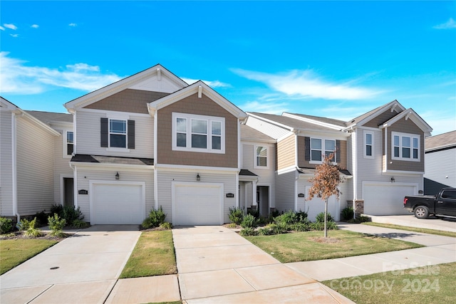 multi unit property featuring a garage