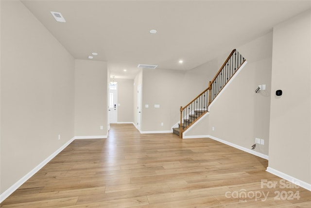 foyer entrance with light hardwood / wood-style flooring