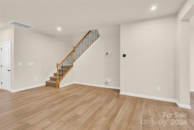 unfurnished living room featuring light wood-type flooring