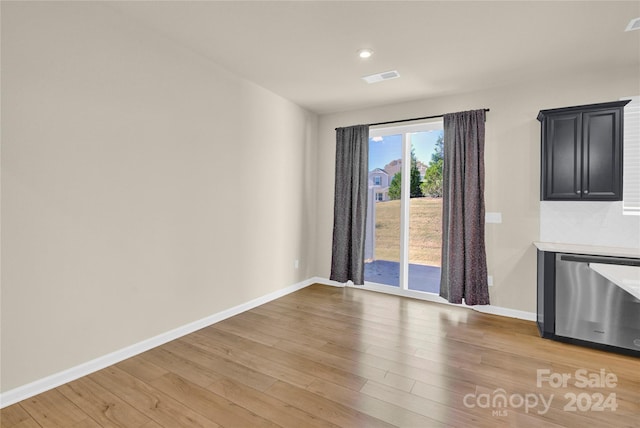 unfurnished dining area with light hardwood / wood-style flooring