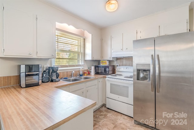 kitchen with white electric stove, sink, stainless steel refrigerator with ice dispenser, ornamental molding, and white cabinetry