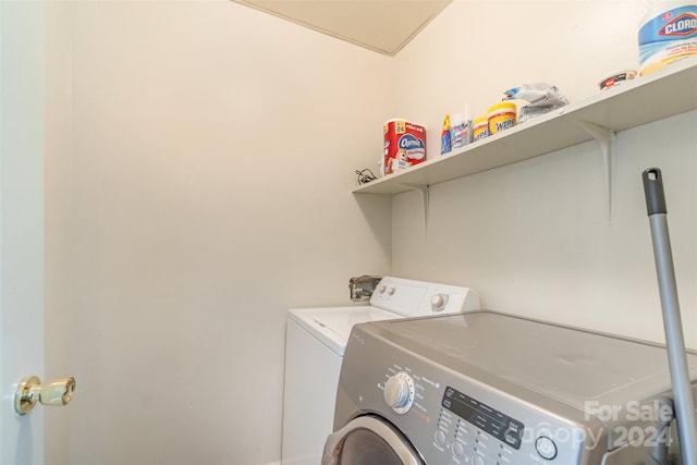 laundry room featuring washing machine and clothes dryer