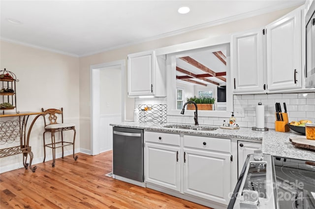 kitchen featuring sink, light hardwood / wood-style flooring, stainless steel dishwasher, ornamental molding, and white cabinetry