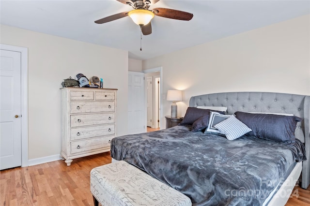 bedroom with ceiling fan and light hardwood / wood-style flooring