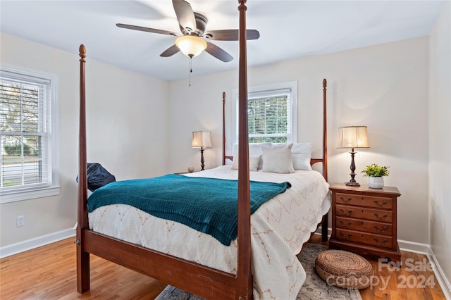 bedroom with hardwood / wood-style floors and ceiling fan