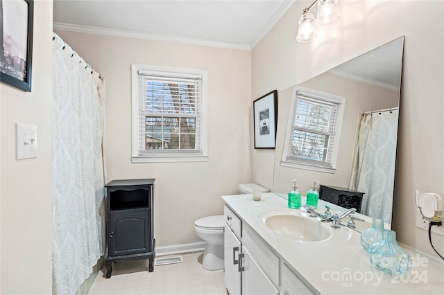 bathroom with vanity, toilet, and ornamental molding