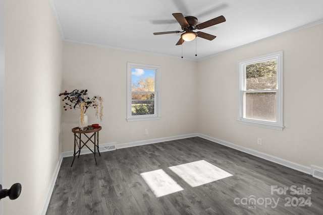 unfurnished room with dark hardwood / wood-style floors, ceiling fan, and ornamental molding