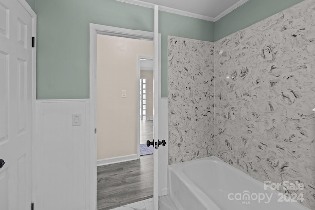 bathroom featuring crown molding and hardwood / wood-style flooring