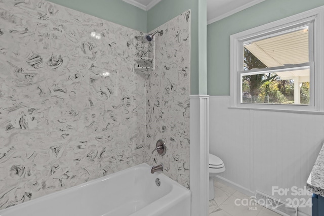 bathroom with shower / bathing tub combination, toilet, and crown molding