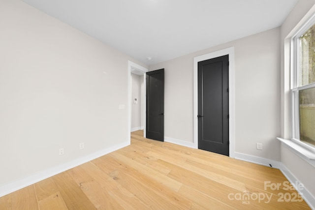 unfurnished bedroom featuring hardwood / wood-style floors