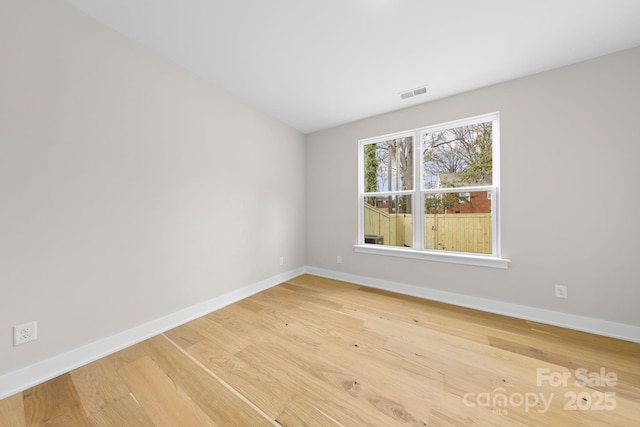 empty room featuring hardwood / wood-style floors