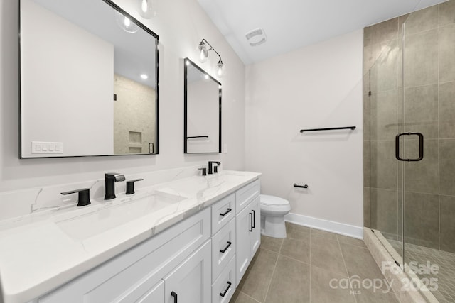 bathroom featuring walk in shower, vanity, toilet, and tile patterned flooring