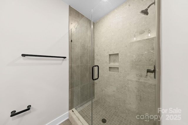 bathroom featuring an enclosed shower