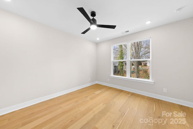 unfurnished room with baseboards, visible vents, a ceiling fan, light wood-type flooring, and recessed lighting