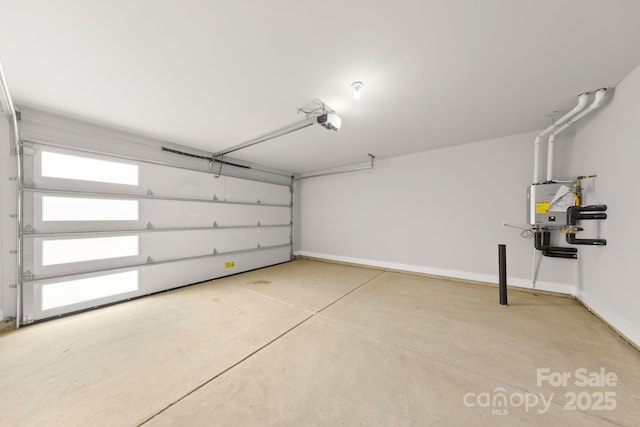 garage with baseboards and a garage door opener