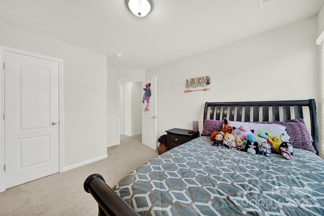 carpeted bedroom featuring baseboards