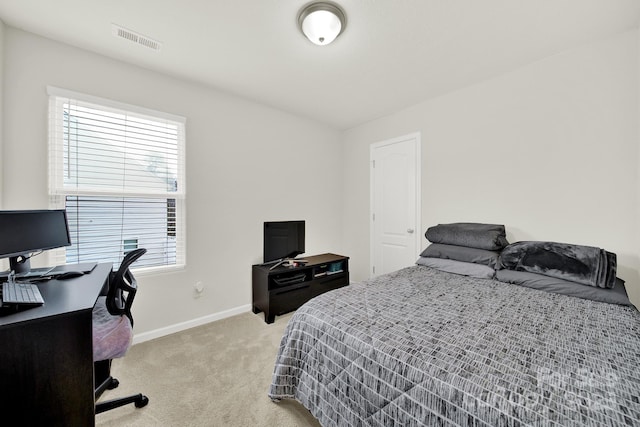 bedroom featuring light carpet, visible vents, and baseboards