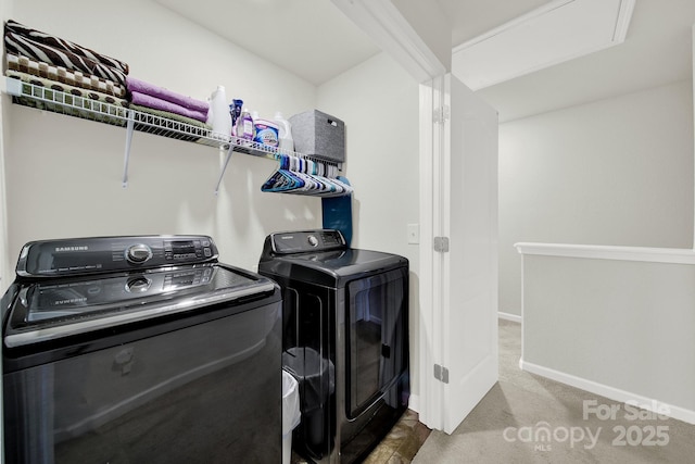 washroom featuring laundry area, washing machine and dryer, baseboards, and carpet floors