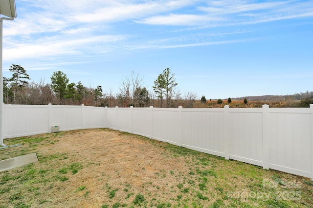 view of yard with a fenced backyard