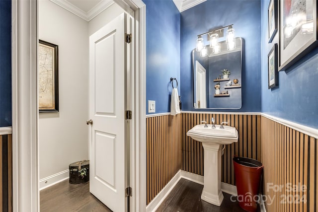 bathroom featuring hardwood / wood-style flooring and crown molding