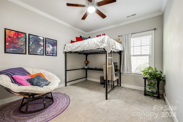 bedroom featuring light carpet, ceiling fan, and crown molding