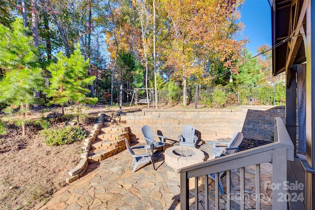 view of patio featuring a fire pit