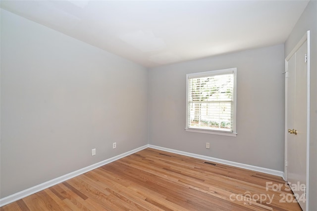 spare room featuring light hardwood / wood-style floors