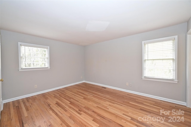 empty room with light wood-type flooring