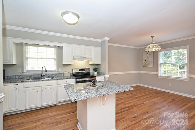 kitchen with light hardwood / wood-style floors, white cabinetry, electric stove, and sink