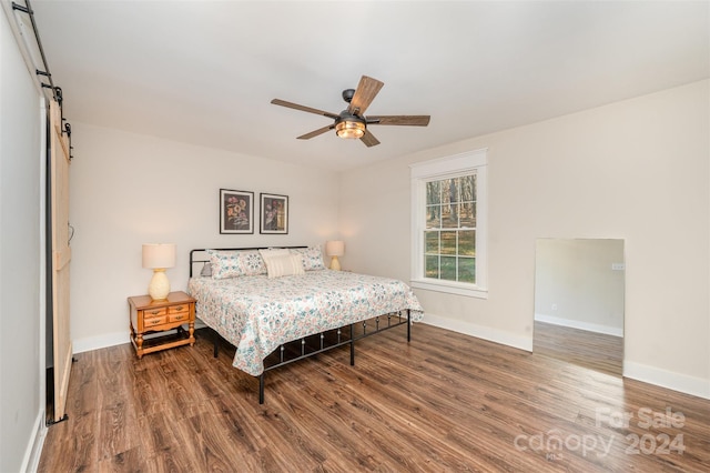 bedroom with hardwood / wood-style floors and ceiling fan