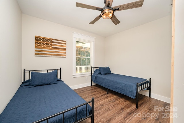 bedroom with ceiling fan and hardwood / wood-style floors