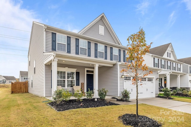 view of front facade with a garage and a front lawn