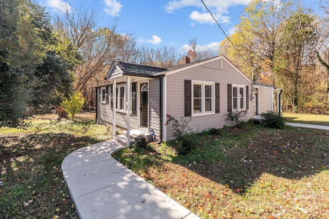 view of property exterior featuring a lawn