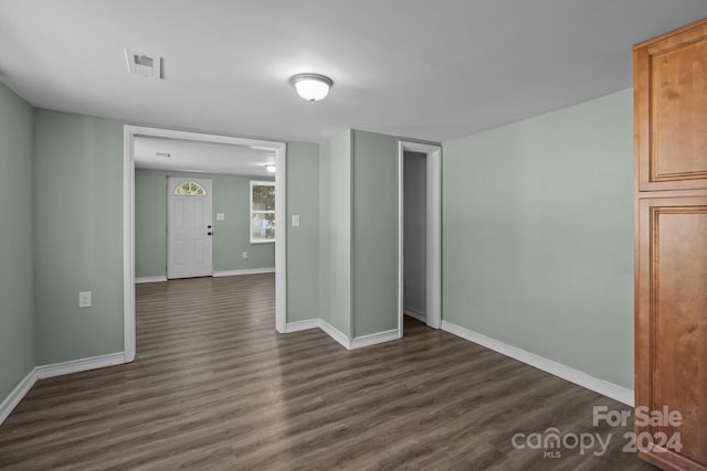 spare room with dark hardwood / wood-style flooring