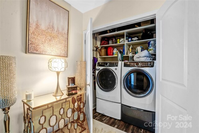 laundry area with washer and clothes dryer and dark hardwood / wood-style floors