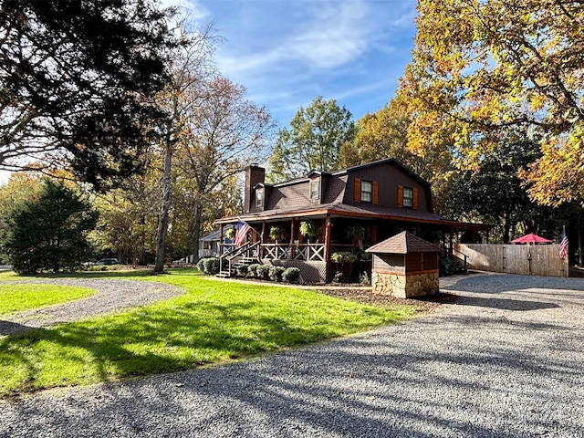 exterior space featuring a yard and covered porch