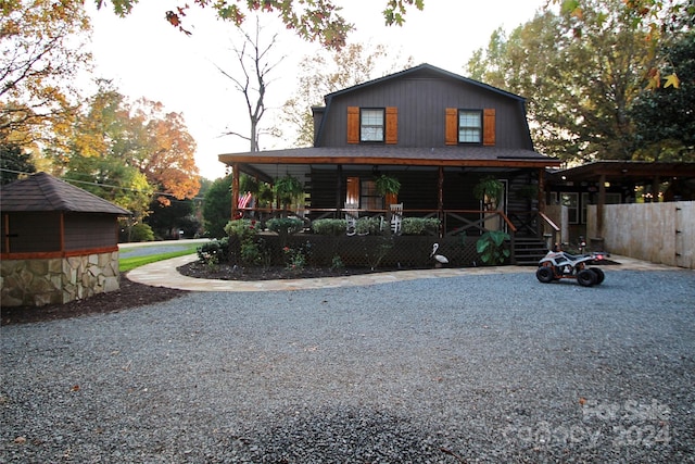 rear view of house with a porch