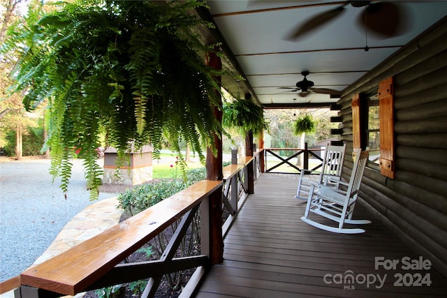 deck featuring ceiling fan and a porch