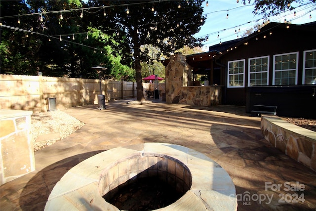 view of patio featuring an outdoor fire pit