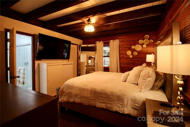 bedroom featuring ceiling fan, beam ceiling, and log walls